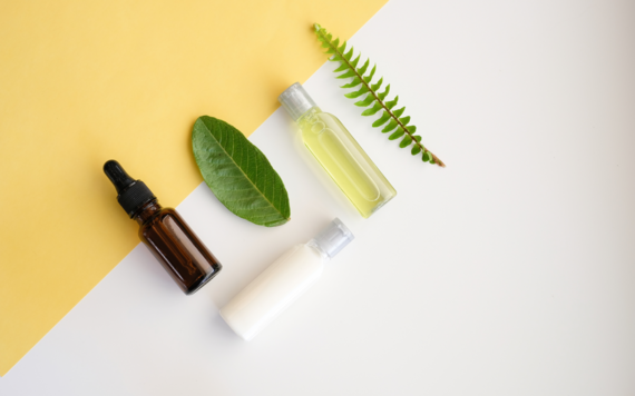 A collection of essential oils and scented items have been placed on a table 