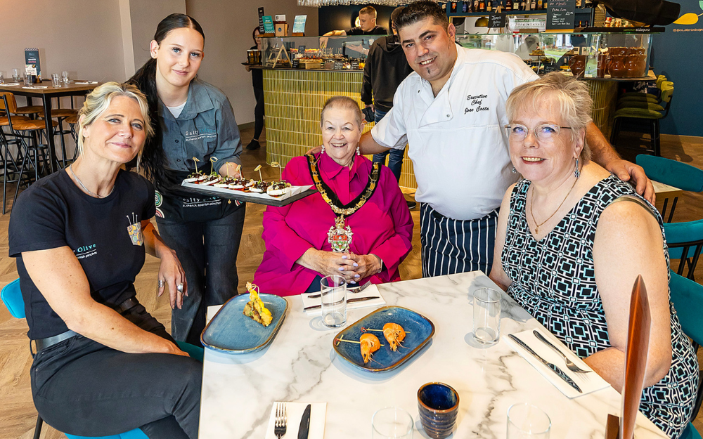 Mayor Cllr Beth Rowland joins founders and staff at Salty Olive in Wokingham