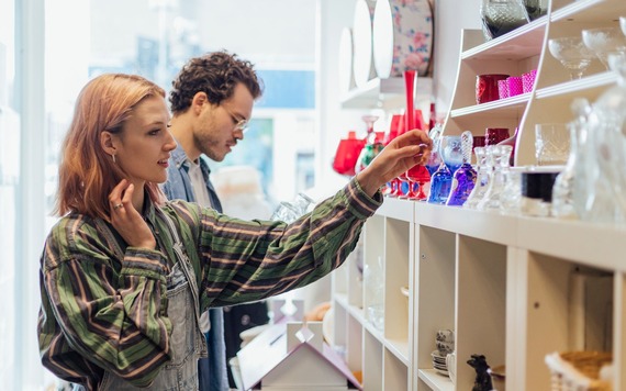 Two people in a charity shop