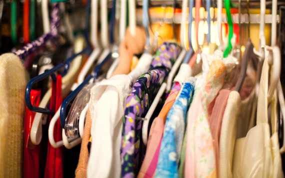 Second hand clothes hanging on a clothes rail