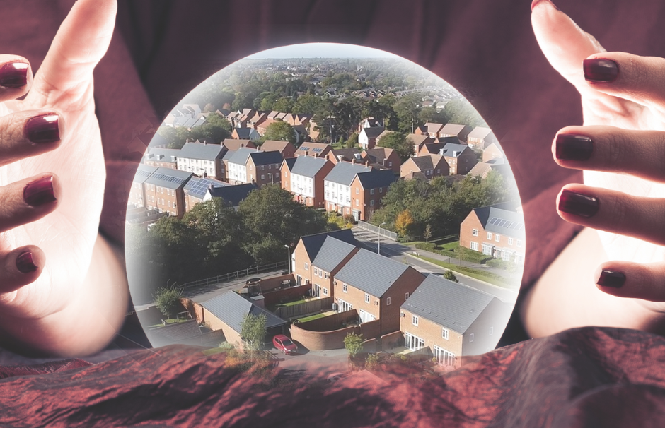 photo of hands round a crystal ball showing an aerial view of a neighbourhood