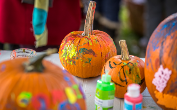 Some pumpkins being painted