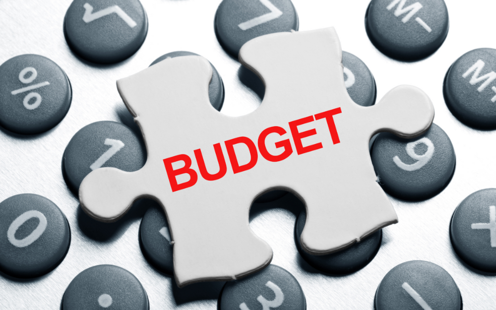 A puzzle piece with the word 'budget' on it