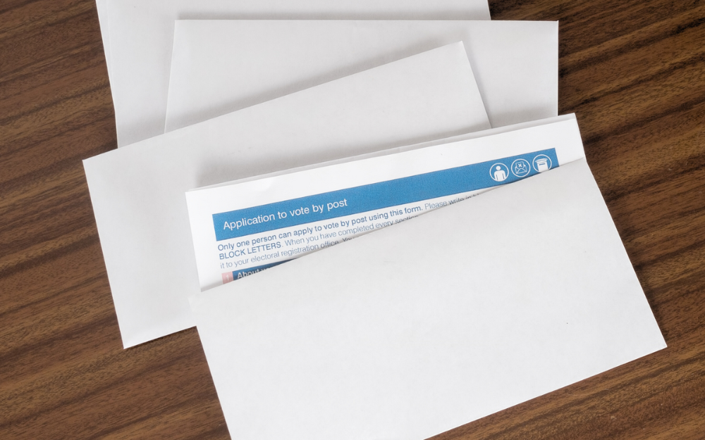 Postal vote application forms in an envelope