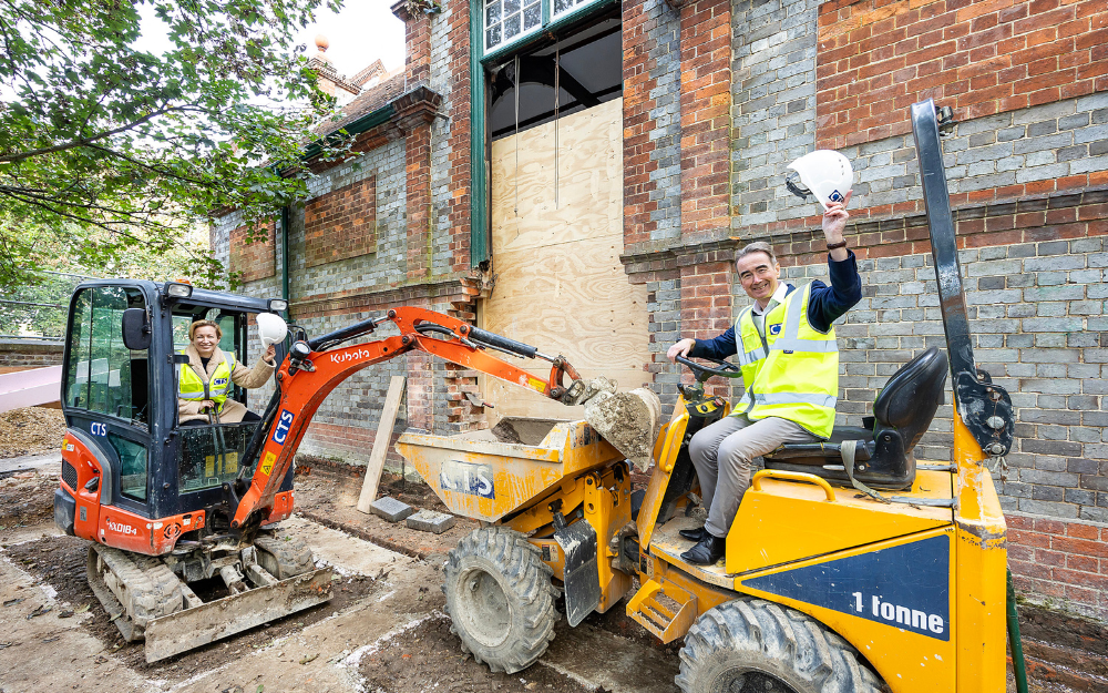 Cllrs Sarah Kerr and Stephen Conway on construction equipment outside Twyford Library