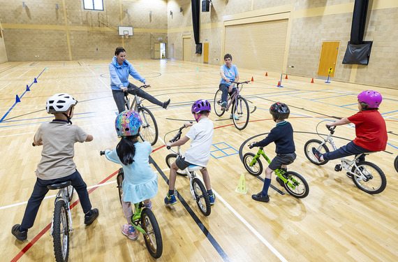 Instructors and group of children cycle training