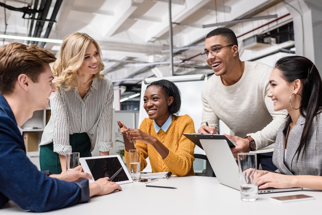 image of people talking and using computers