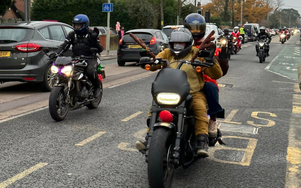 Dozens of motorcylists in festive attire make their way to Wokingham on the Reading Toy Run