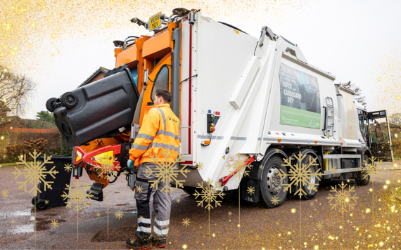 A waste collection crew loading wheeled bins onto a waste vehicle