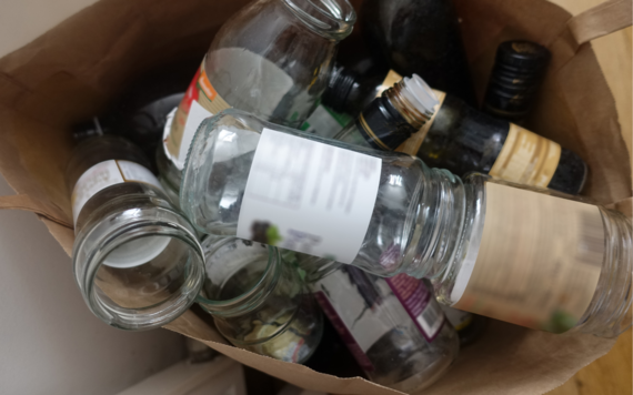 A top view of a bag of glass bottles