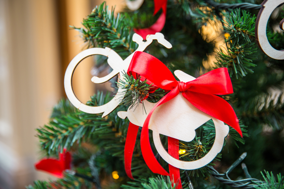 Close up of a Christmas tree decoration in the shape of the outline of a bicycle