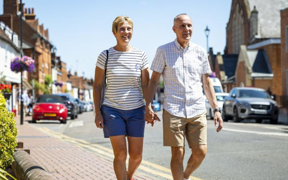 A couple walking down a street in Wokingham Borough 