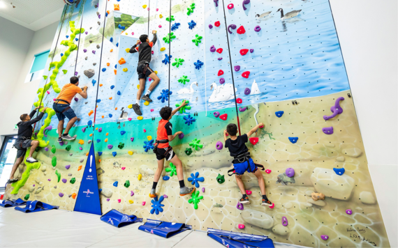 People having fun with indoor climbing at Dinton Activity Centre