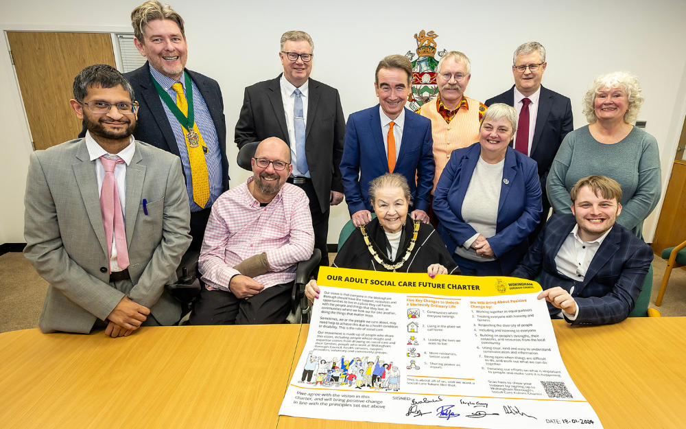 Smiles from members of the core group as the Social Care Future charter being presented to councillors