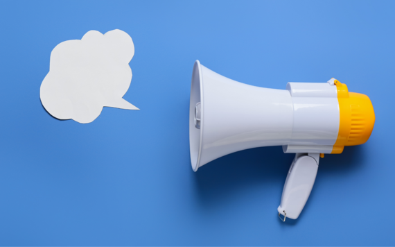 A white megaphone with a white thought bubble coming out of it, set against a blue background