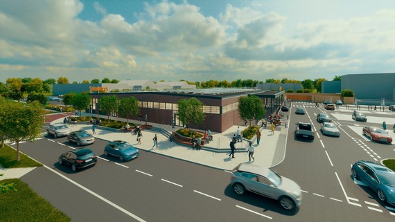 Computer generated image of a modern, medium-sized Sainsbury's supermarket surrounded by planting, car parking and wide pedestrian access