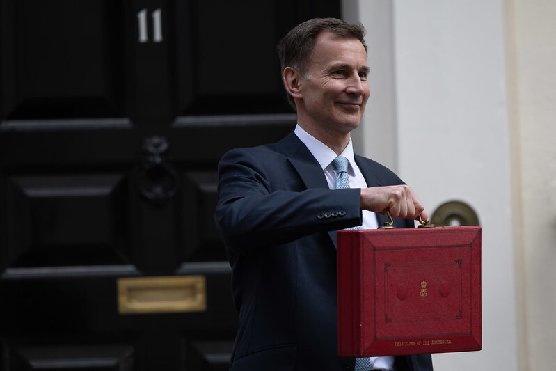 image of chancellor holding red briefcase