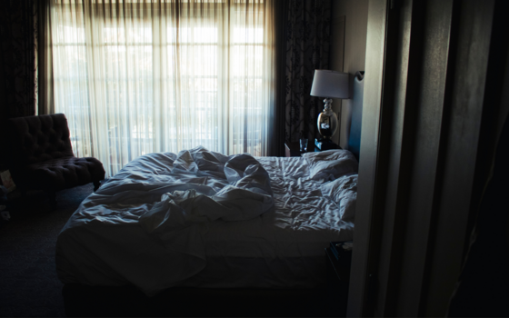 A rumpled and unmade bed