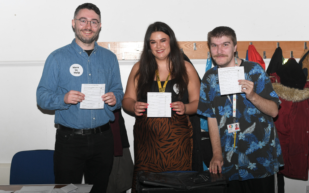 Elections colleague using a mock ballot box at CLASP session