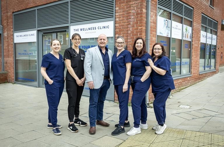 A group of six medical staff standing outside a private clinic in Wokingham town centre