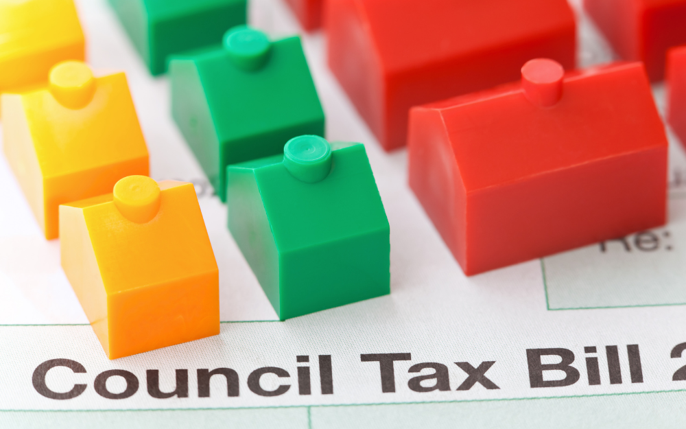 Council TAx bill with model houses placed on top