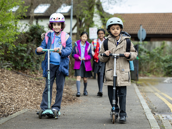Children scooting and walking to school