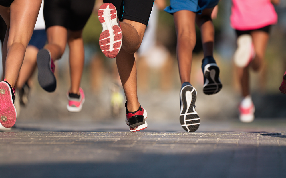 Runners feet moving across the tarmac