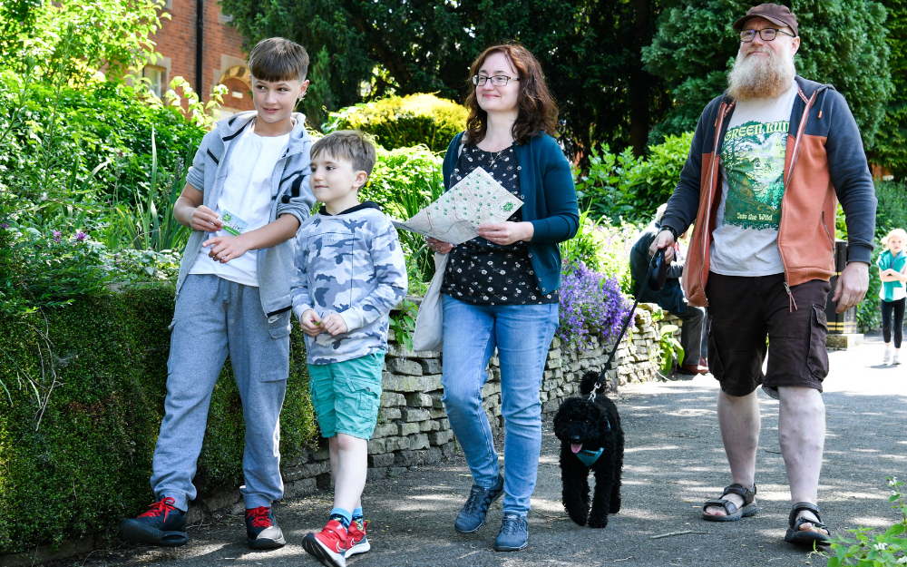 Family walking down street taking part in Beat the Street