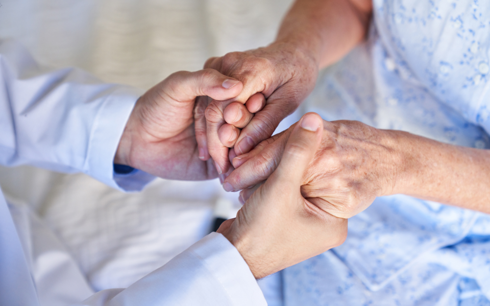 Two setss of hands clasped together in support