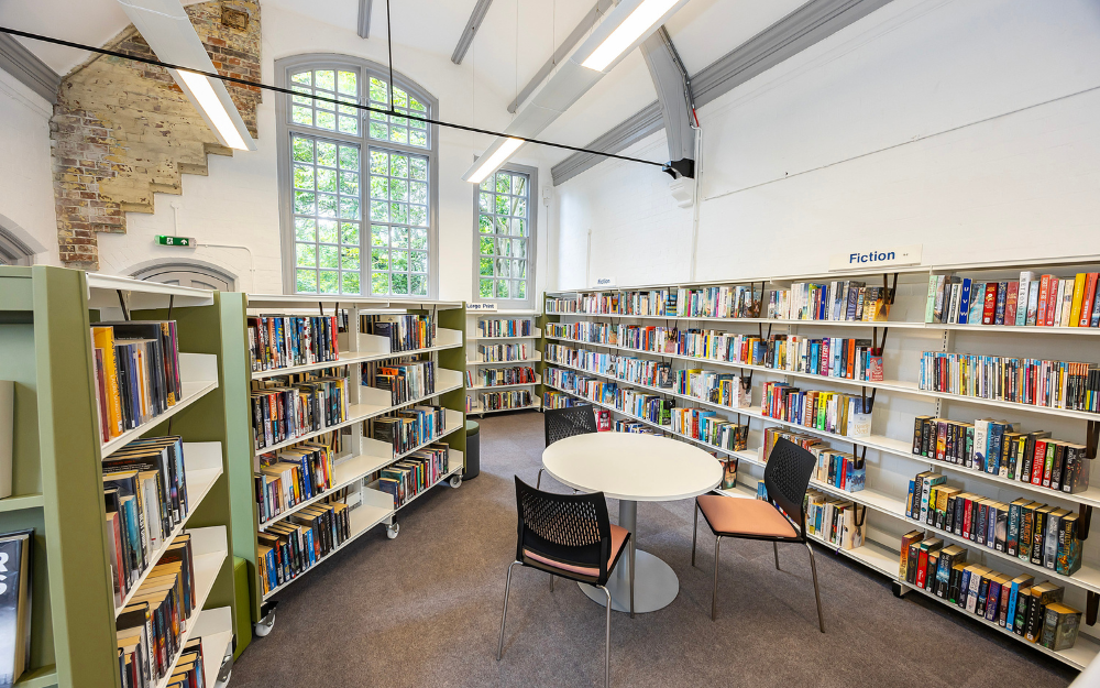 Seating and thousands of books lining shelves around Twyford Library