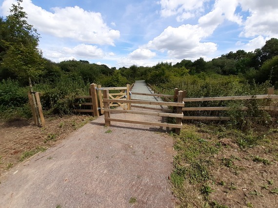 Photograph of a wooden kissing gate on an attractive new country path in Arborfield Green