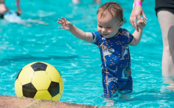 A child having fun at paddling pool in California Country Park