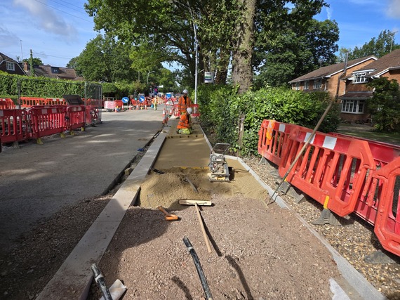 Workers laying block pavements