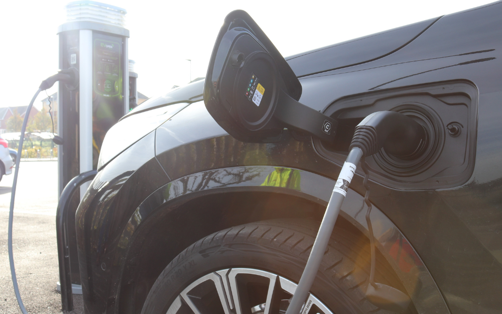 An electric car plugged in for charging