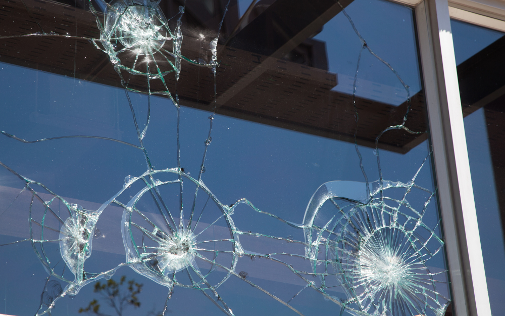 Shattered glasses in windows from things being thrown at them