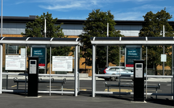 Two bus stops and parking machines at Winnersh park and ride