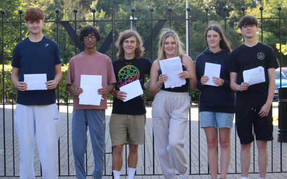 A level students with their result papers at Waingels College in Woodley