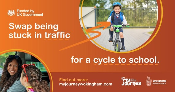 Child on bike and two people in a car