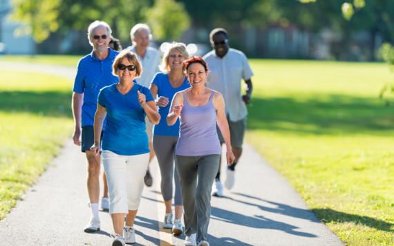 Men and women walking in a park