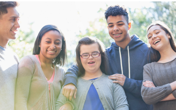 A group of teenagers laughing together