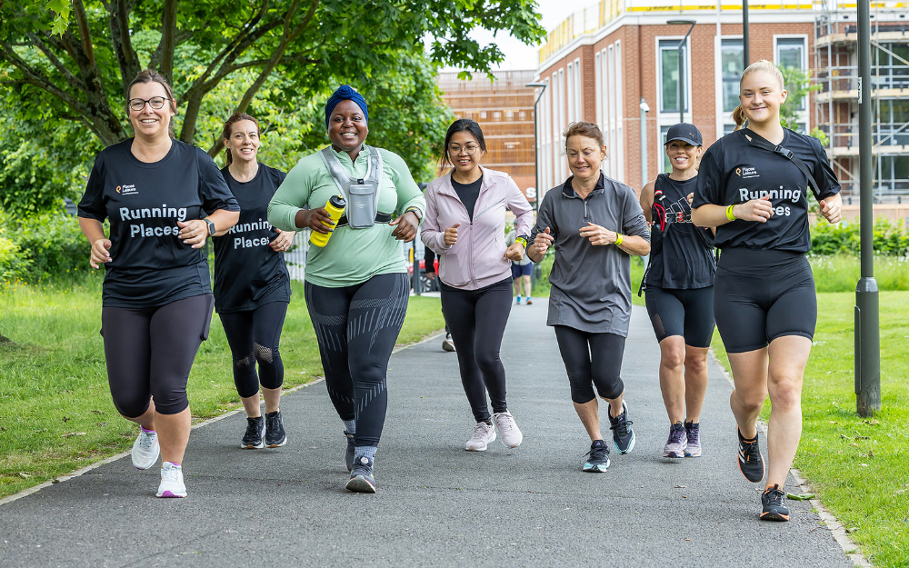 A group of runners smile to the camera as they head out in Wokingham