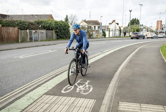 A cyclist cycling along the road