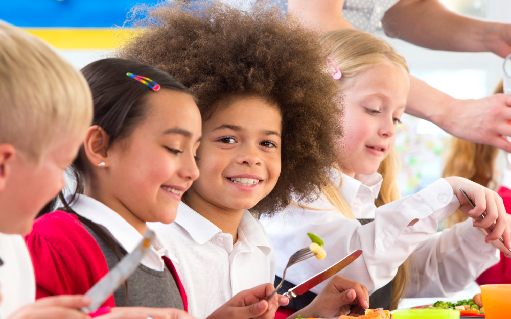 Primary school children sat in a row