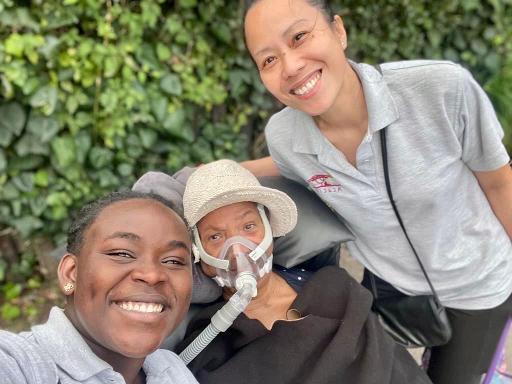 Carers looking after a client high res