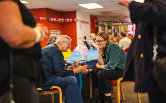 people chatting over lunch at a gathering event 