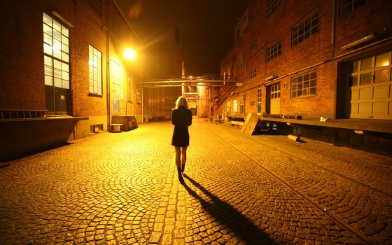 woman walking in the dark