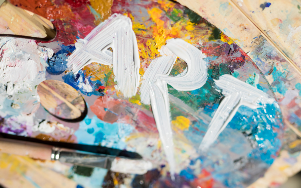 Paint on a canvass, with the word art brushed over the top