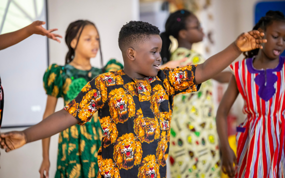Children dancing during a Black History Month assembly