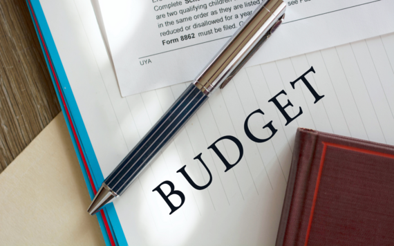 A stock image: Close up of a corner of a document with text reading Budget 