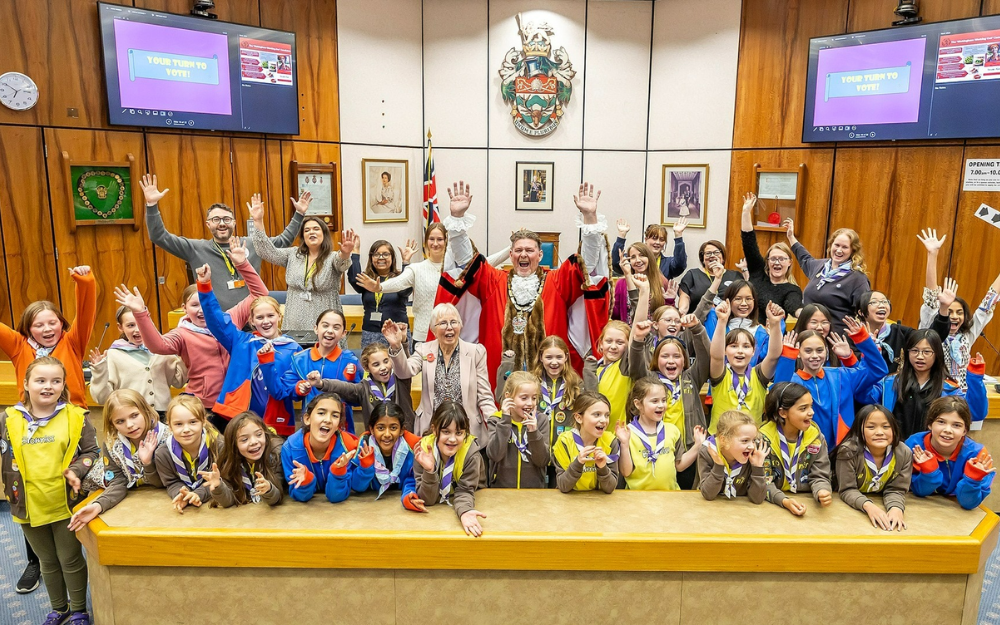 Brownies and guides joined by mayor and council staff in the council's Shute End office